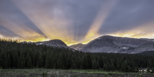 Sunset rays over Colorado mountains